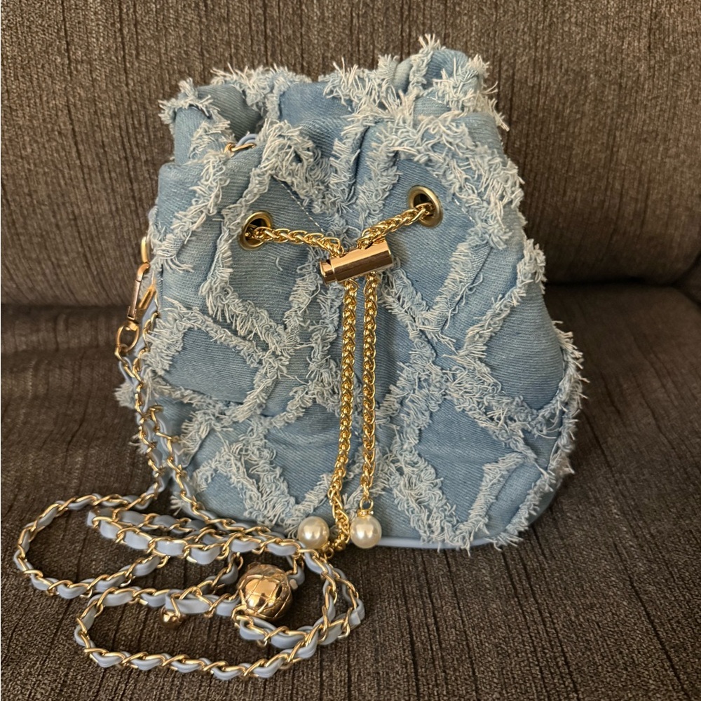 Stylish Denim Bucket Bag with Gold Accents